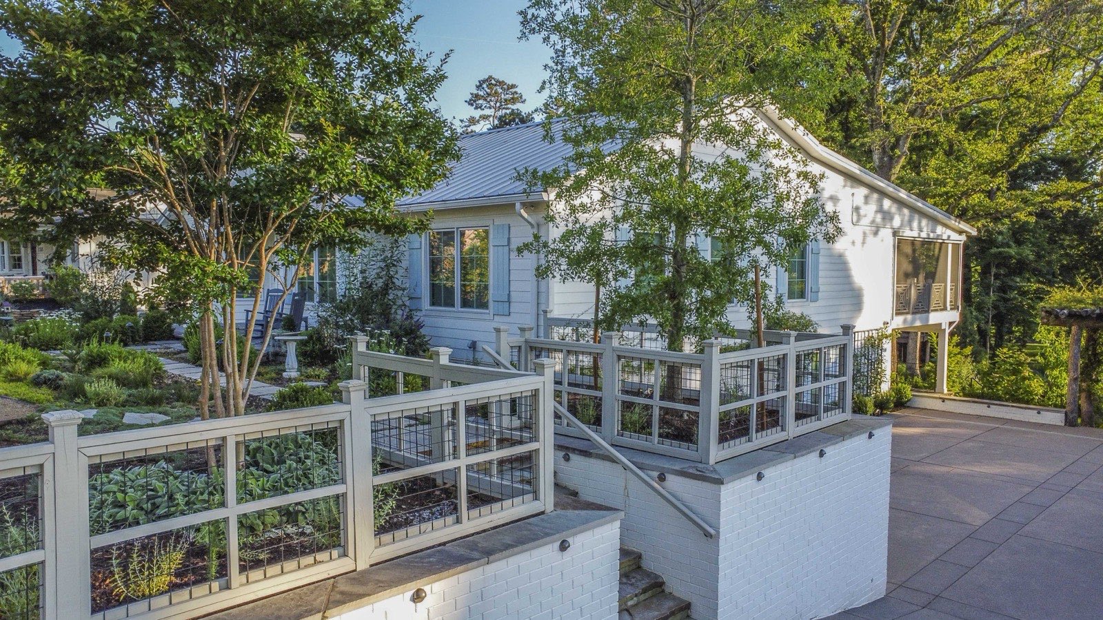 Overhead aerial of the multi-level decks and layered backyard gardens