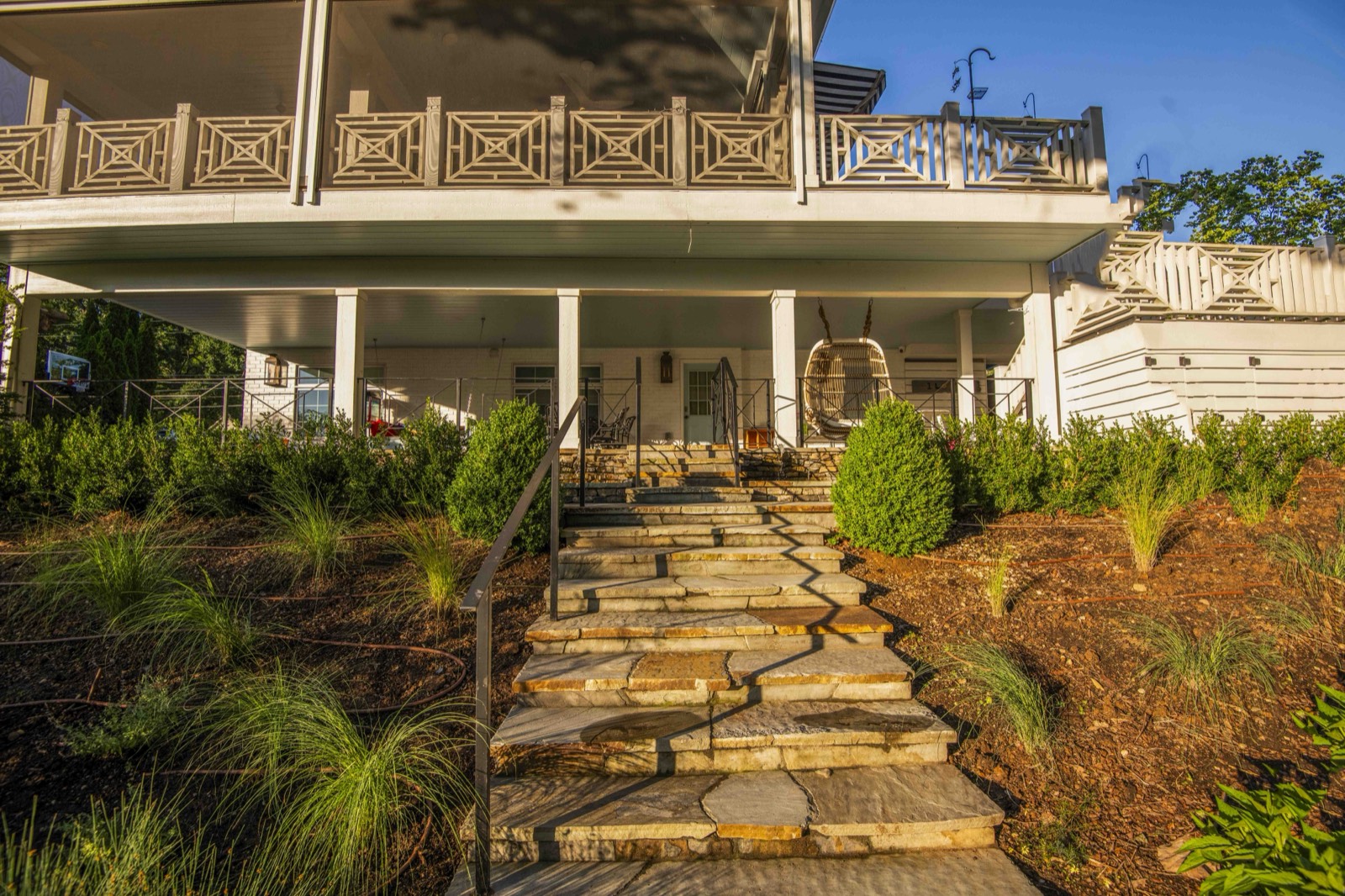 Natural flagstone steps and landing rising to a covered porch