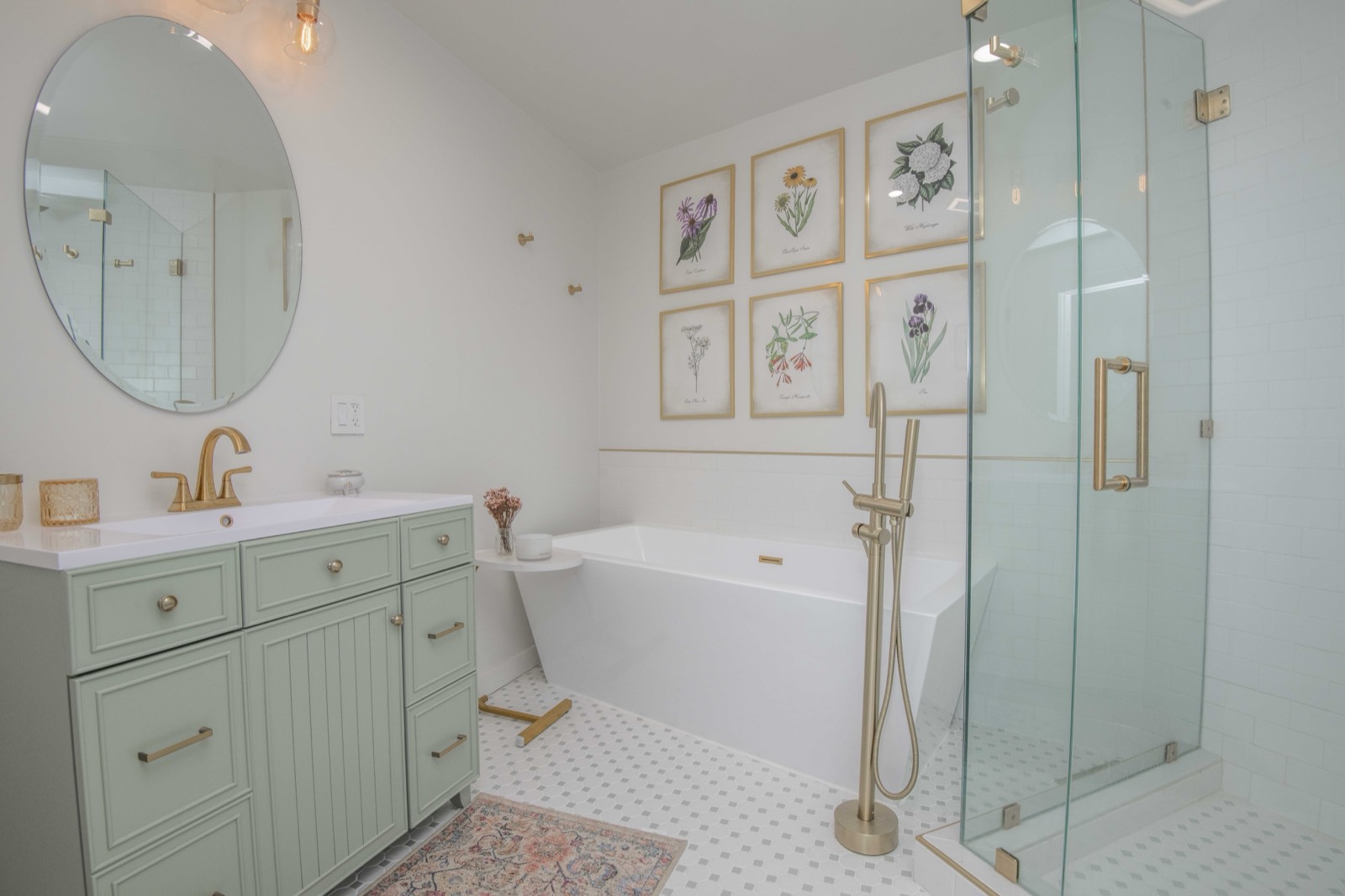 Bright bath with a vanity, freestanding soaking tub, and glass shower